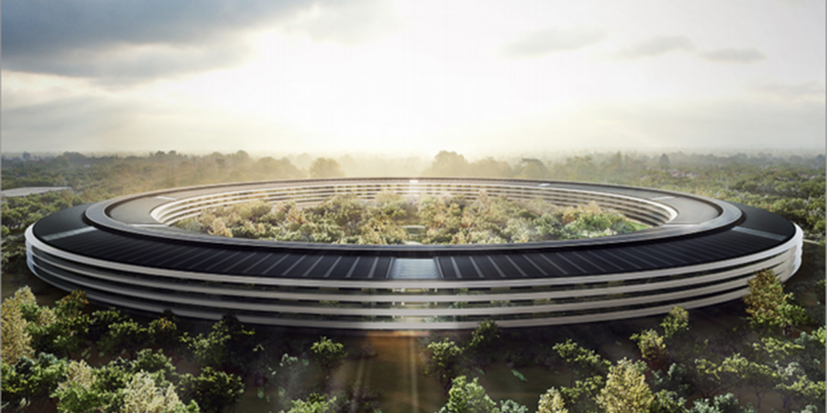 A panoramic of a futuristic circular building with trees inside.