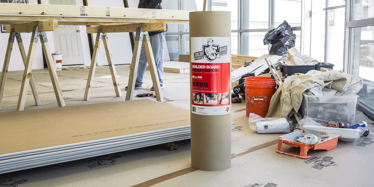 Photo of a roll of Builder Board protective material in the middle of a workspace.