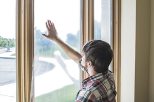 Guy applying window shield